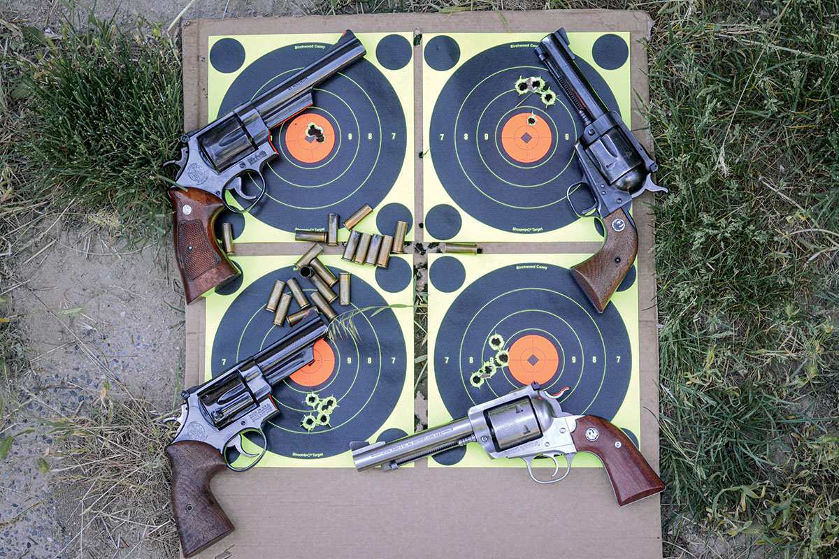 One load fired in four guns at 25 yards illustrates the consistent accuracy of 41 Magnum guns.